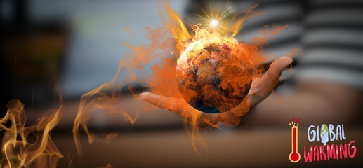 Image of person holding virtual globe and flame It is a powerful image that conveys the urgency of...