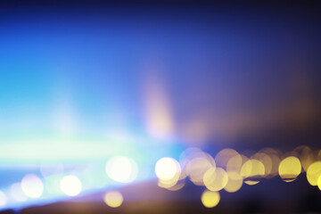 Abstract bokeh background. Golden bokeh circles on dark blue background. Layer overlay.