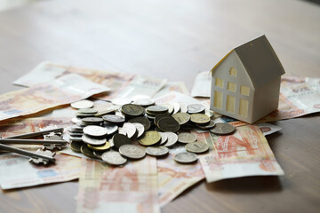 Russian money and a house. Ruble mortgage. house symbol with money, russian rubles on the calculator