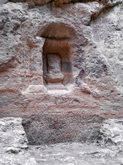 Religious  altars with Nabataean writings carved into Al Siq gorge wall of Historical Reserve of Petra near the Wadi Musa city which is home to the Petra in Jordan
