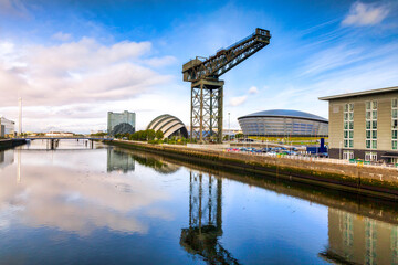Clyde waterfront regeneration with a wide view of the modern buildings and the  crane.