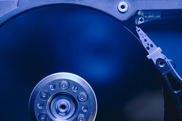 closeup top view of computer hard disc drive without cover. toned blue image. - 784215991