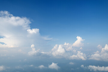 Aerial view clouds and blue sky from airplane window