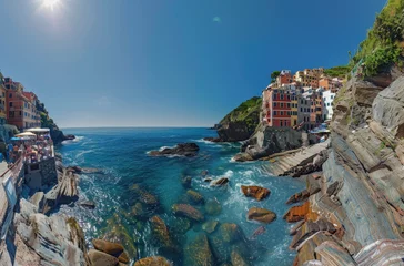 Foto auf Glas A colorful Italian village on the cliffs of Cinque Terre overlooking the blue sea © Kien