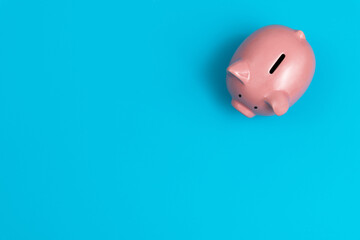 Piggy bank on blue background
