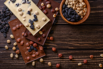 Chocolate bar pieces. Background with chocolate. Sweet food photo concept.