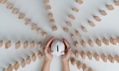 People hand protected piggy bank