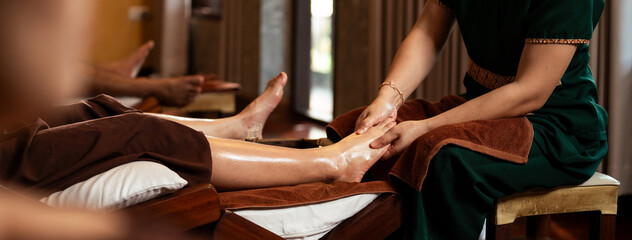 Selective focus on hand, Masseuse acupressure massage on feet of customer. Masseuse service foot...