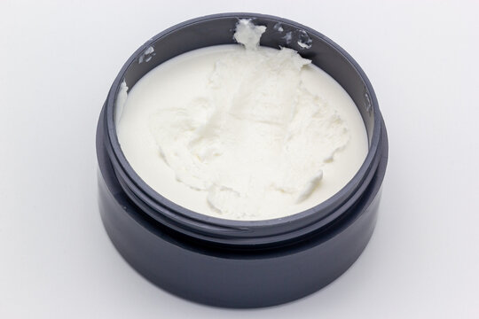 A can of hair paste on a white background. Hair paste is similar to hair gel and is used for styling purposes.