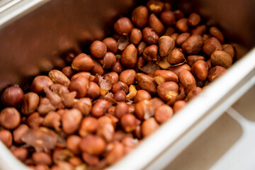 Nuts and dried fruits for making handmade chocolates and candies in a workshop
