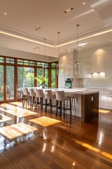 An expansive modern kitchen interior with bright natural light
