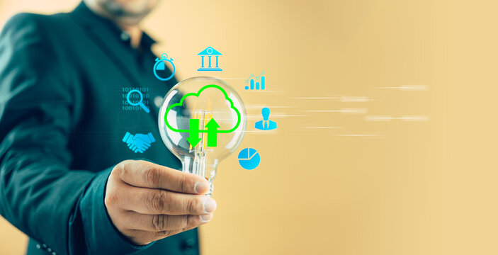 Man holding a light bulb to think and create new ideas, cloud computing, technology big data and business process strategy and smart industry.