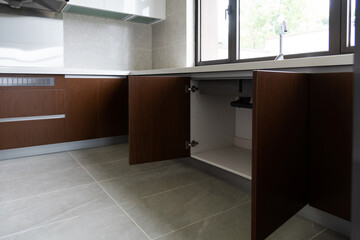 Open the cabinet under the sink