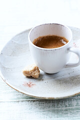 Cup of coffee on bright wooden background. Soft focus. Close up. Copy space.	