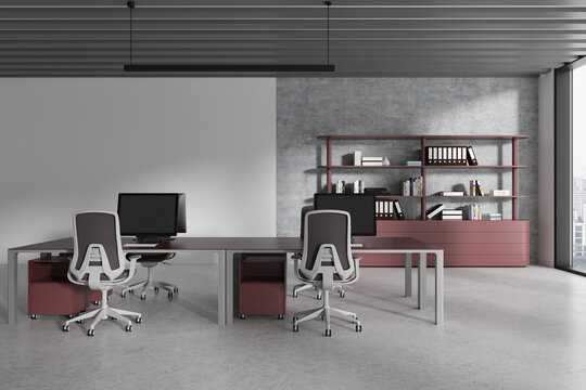 Gray and maroon open space office interior with workspace near blank wall