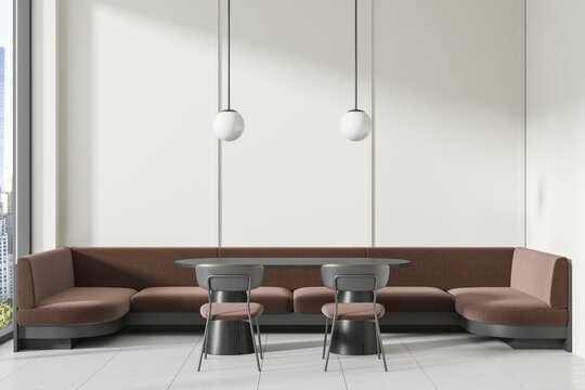 Modern cafe interior with a cozy corner booth, round tables, and designer chairs, bright natural lighting, and urban view. 3D Rendering