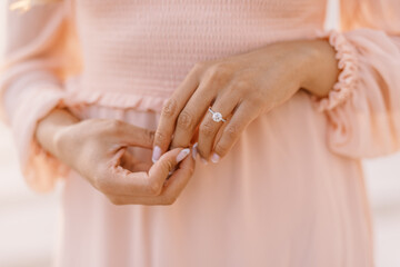 Close-up of elegant engagement ring on hand