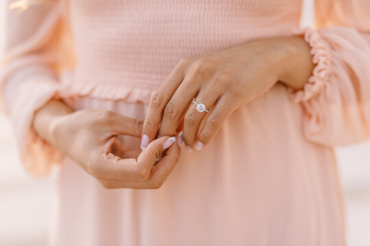 Close-up of elegant engagement ring on hand