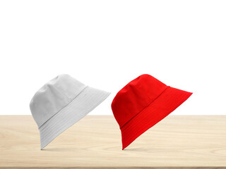 White  red bucket hat on a wooden table PNG transparent