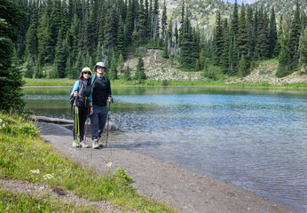 Couple hiking Shadow Lake Trail. Sunrise area. Mount Rainier National Park. Washington State. - 784311933