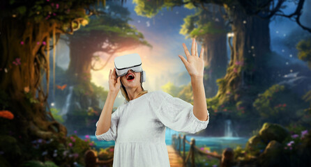 Happy woman surprised or excited while looking though VR glasses and standing at fantasy forest....