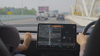 Adorable little boy leisure in car travel with navigator summer vacation trip. transport technology