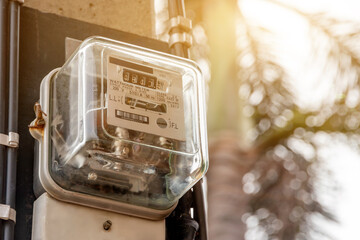 Electricity power box meters for home electrical appliances, including blurred natural green backgrounds, electric power usage concepts