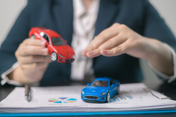 Car insurance concept. Agent negotiated a comprehensive insurance agreement for the auto business, covering all aspects of vehicle transport and automobile protection.