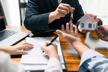 Real estate agent facilitated sale of property through mortgage loan, ensuring smooth investment process for purchaser with help of skilled broker. Concept of loan, insurance, approval, real estate.
