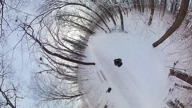 Embark on a captivating journey through a serene winter forest in this 360-degree video. The immersive footage, captured with a fisheye lens, offers a unique perspective as if youre right there. The