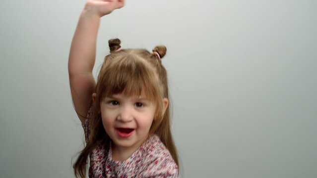 Close-up of a Caucasian girl cheerfully fooling around and smiling. High quality FullHD footage