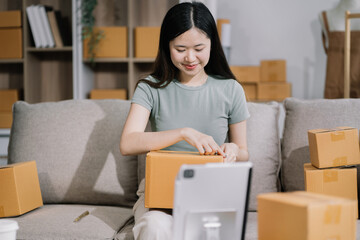 Young asian Woman Thinking and Working on sell online in cozy house, Modern Lifestyle of New...