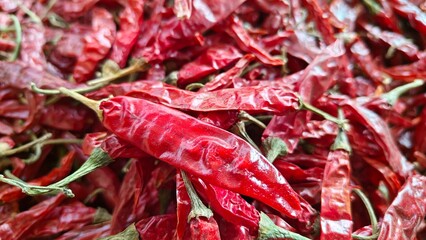 Dry hot red chillies on white background from top view