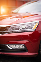 Close up detail on one of the red car taillight modern red crossover car. Exterior detail business...