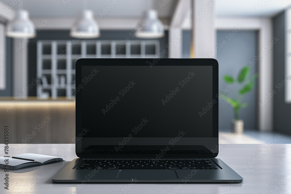 Poster Close up of modern designer desktop with empty mock up laptop monitor and blurry office with bookshelves in the background. 3D Rendering.