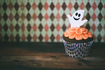 Halloween design cupcake on dark background