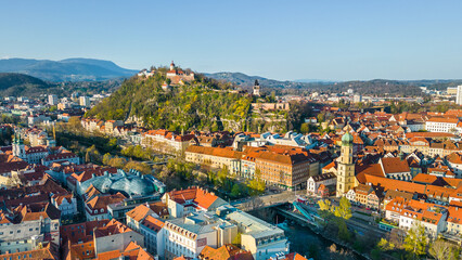 Fototapeta na wymiar Panorama view of Graz city in Austria with the historic city centre and the Schloßberg hill