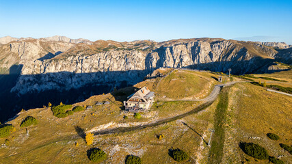 Idyllic mountain hut with the Hochschwab mountain in the background. Beautiful mountain view from...