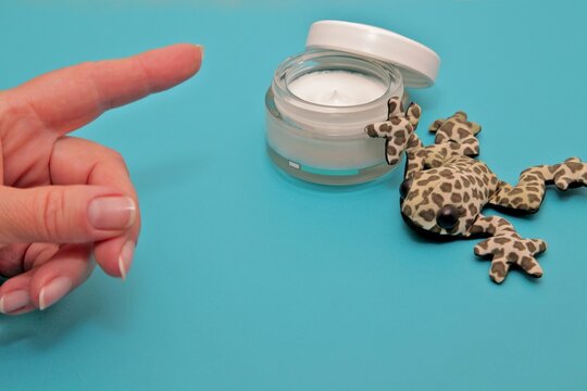 Even frogs are interested in moisturizing cream. Photo joke.