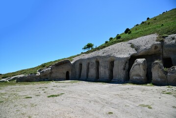 Closeup of beautiful stone caves at the Tepe Kermen under a hill in Crimea