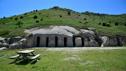 Closeup of Historical stone caves at the Tepe Kermen under a hill in Crimea