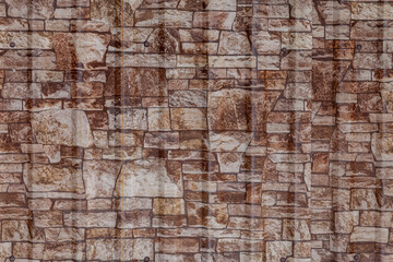 textured metal panels imitating a stone wall