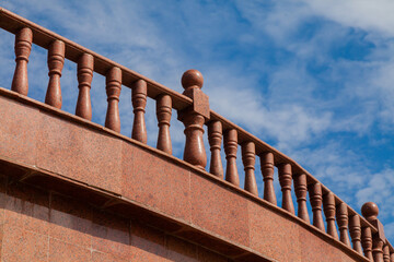 Granite balustrades railing made of red granite. Architectural elements.