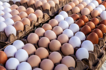 Homemade chicken eggs are sold at the farmers market. - 784358551