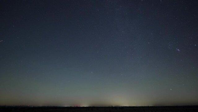 Timelapse video of the starry sky at night with shooting stars and asteroids