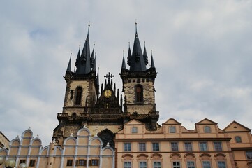 Low angle of The Church of Our Lady before Tyn against the sky in Prague, Czechia - Powered by Adobe