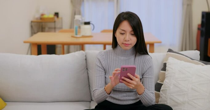 Woman use cellphone at home