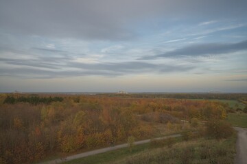 Aerial of a colorful autumn scene with an overcast sky above the lush trees in Hanover, Germany