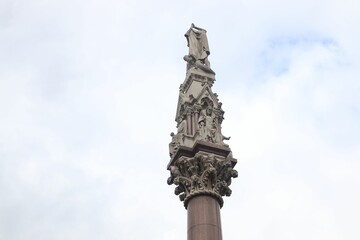 Fototapeta na wymiar Westminster Scholars War Memorial in London, UK under a bright cloudy sky