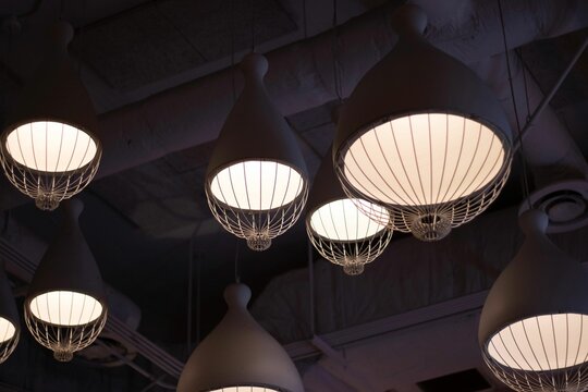 Modern chandeliers hanging from a ceiling